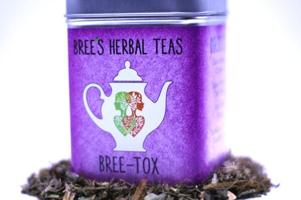 Herbal Detox Tea in a purple tea container with a white teapot on it