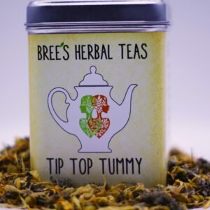 Digestive herbal tea blend in a yellow tin with herbs surrounding it and a white background