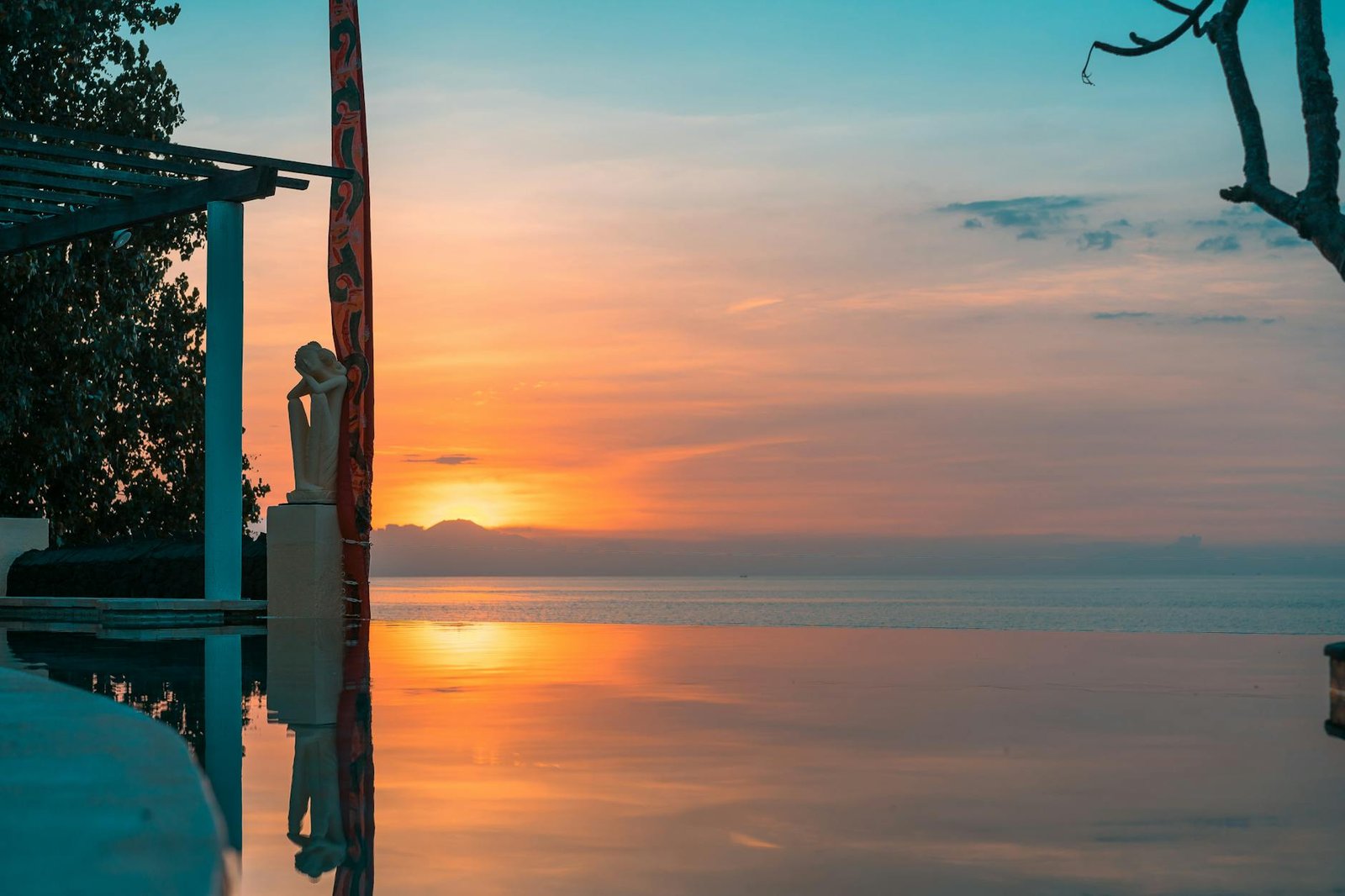body of water with sunset behind